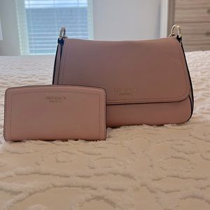 Pink Kate Spade purse and wallet. Gently used and no marks or scuffs. Like new!